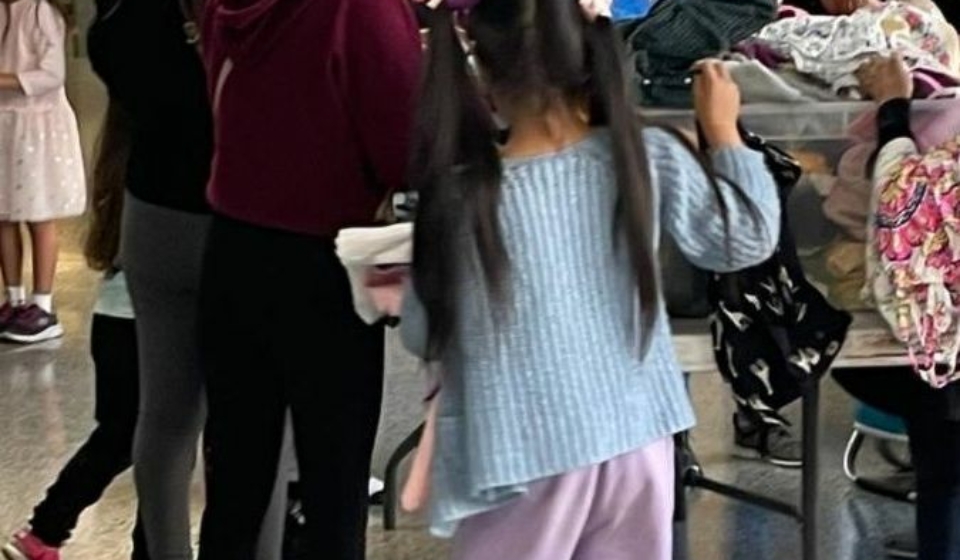 Migrant Families Being Given Clothing at P.S.1